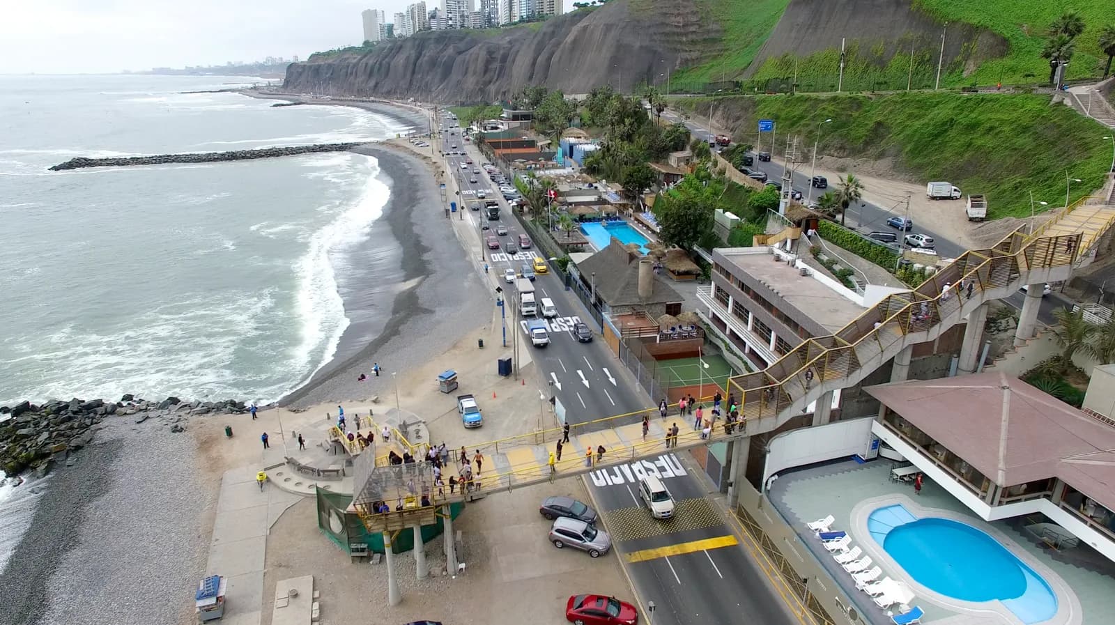 Aerial view of the Miraflores malecón in Lima, green clifftop parks and high-rises above the Pacific on the Costa Verde